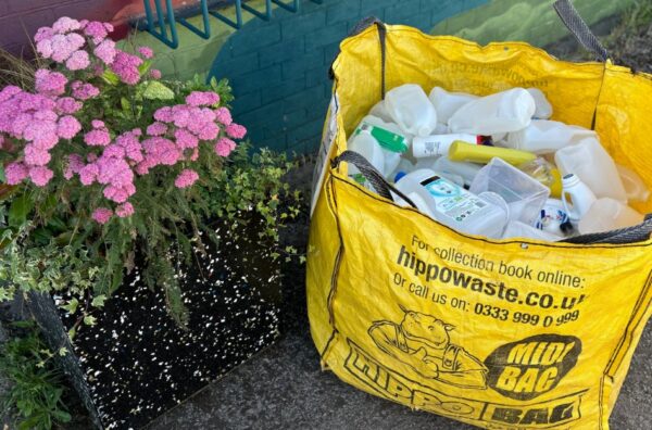 Waste bag of plastic with recycled plant pot