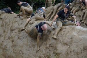 Plastek Team member falling in the mud