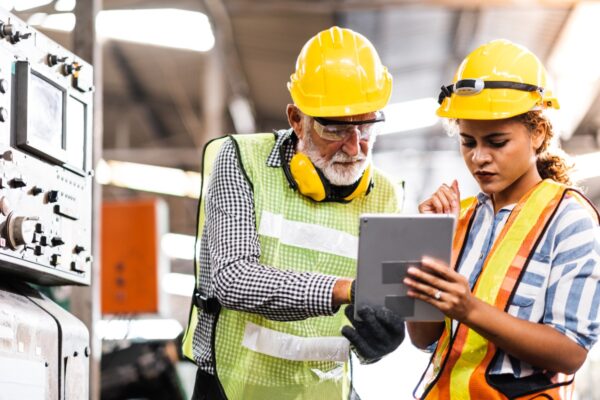 Man and women with an ipad